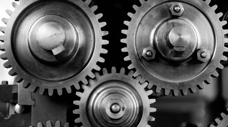 Close-up of metal gears interlocking in a machine