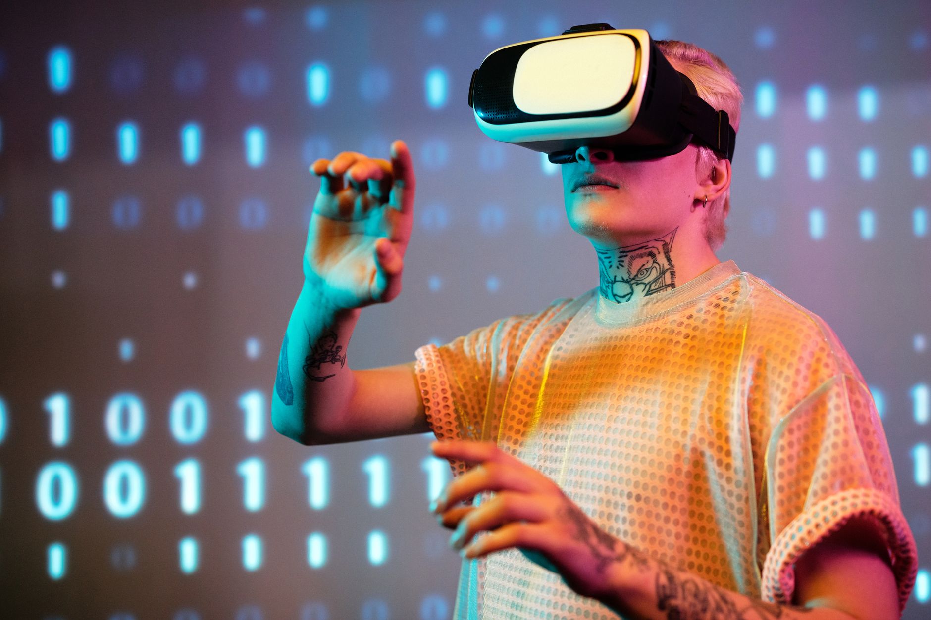 A young man interacts in virtual reality wearing a headset with a digital binary background. — Why an AI-Powered Investment A